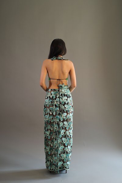 Rea by Rhea lookbook: back view of a green floral maxi dress with an open tie back