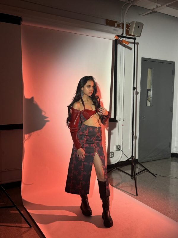 Rea by Rhea lookbook: full studio frame with lighting stands, a model in floral skirt and knee-high boots