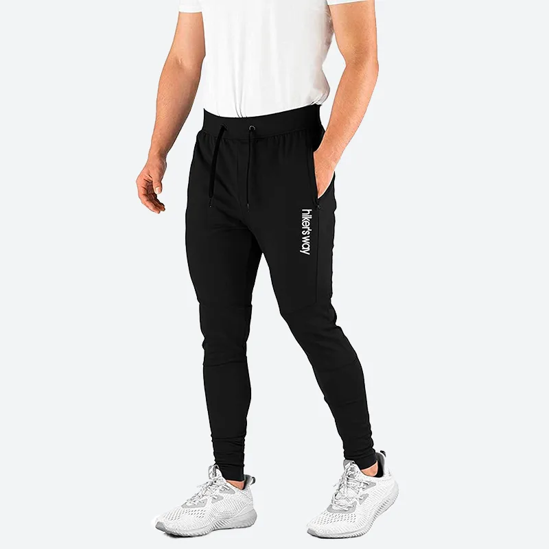 hiker's way Track Pant for Men — black track pants worn with white trainers